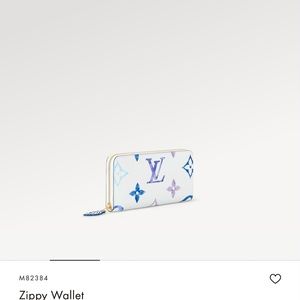 Louis Vuitton collection purse with matching wallet.